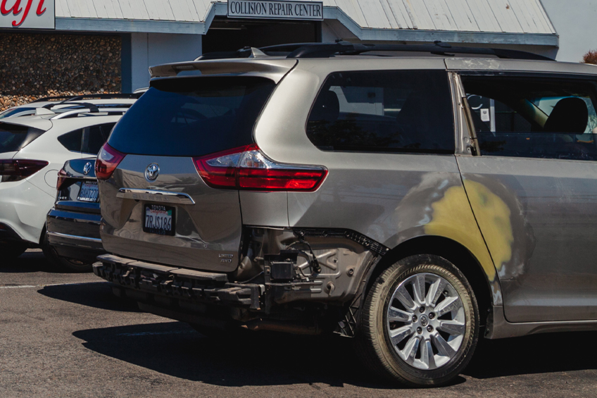 dent A car damaged car in need of collision repair in San Rafael